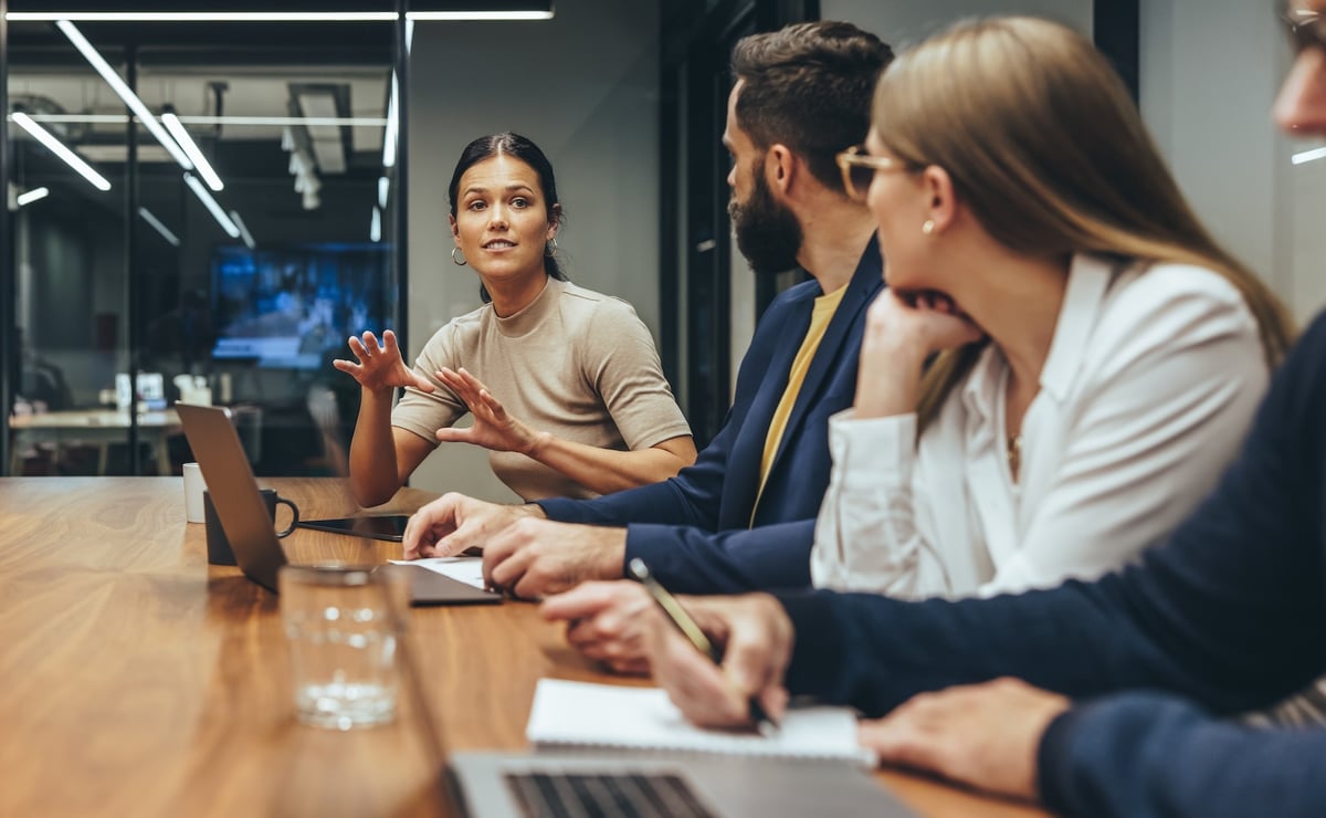 Young businesswoman leading a discussion during a meeting with her colleagues.